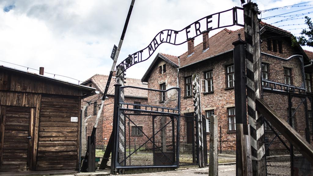  The gate at Auschwitz bearing the phrase 'Arbeit Macht Frei' 