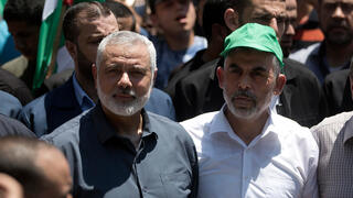Hamas political bureau leader Ismail Haniyeh and Hamas leader in Gaza Yahya Sinwar 