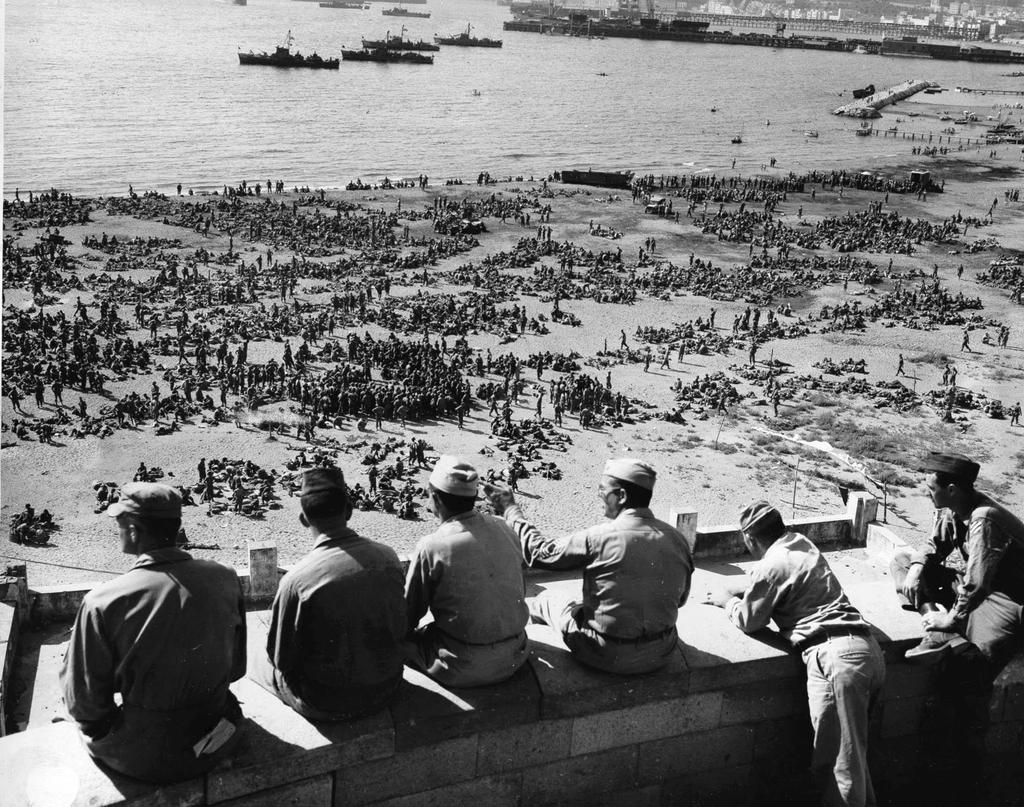 Thousands of U.S. 3rd Division troops wait to board Landing Ships Tanks on an unidentified beach in Italy in preparation for Operation Dragoon, August 10, 1944