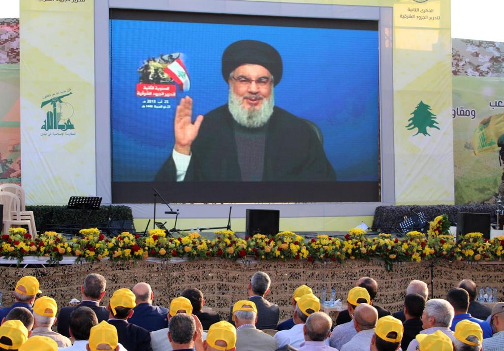 Hezbollah leader Hassan Nasrallah speaking via video to a rally of the terror group 