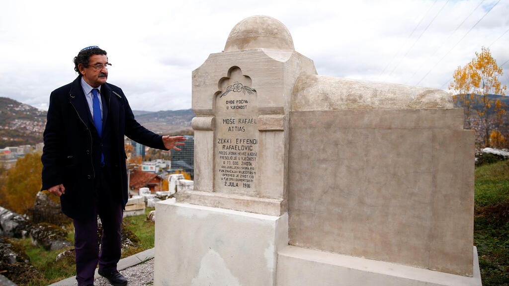 Eli Tauber stands near the resting place of a Jewish historian, whose real name was Mose Attias, known as Zeki Effendi Rafaelovic, at the Jewish cemetery in Sarajevo, Bosnia and Herzegovina, Nov. 6, 2019