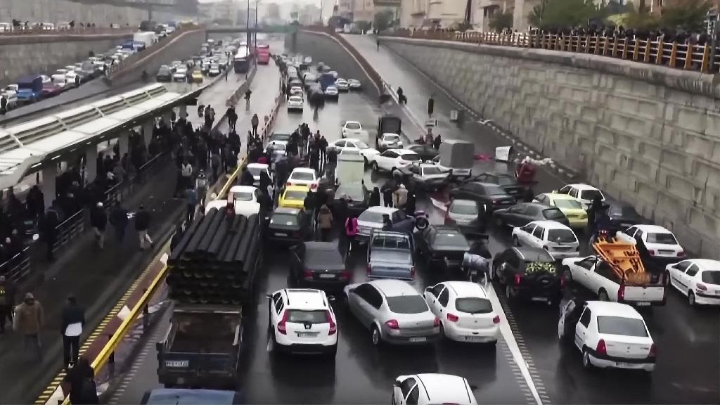Iranian protesters block a road during a demonstration in Tehran against an increase in gasoline prices, Nov. 16, 2019 