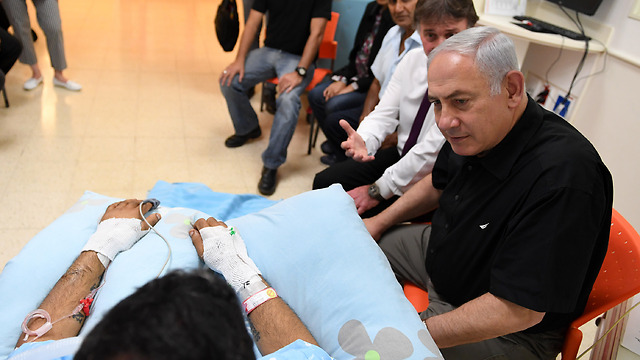 Prime Minister Benjamin Netanyahu visits wounded Niv Nehamia