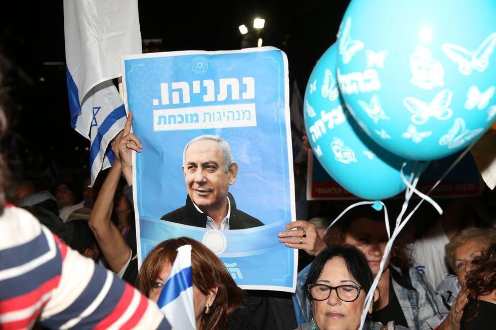 Supporters of Benjamin Netanyahu rally in Tel Aviv after he was indicted for corruption in November 2019 