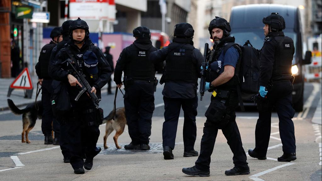 Armed London police officers at the scene of the attack  