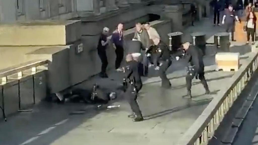  Armed police surround the terror suspect on London Bridge