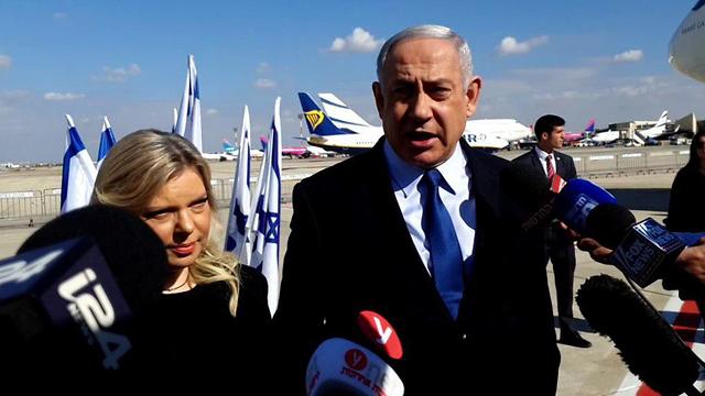 Netanyahu and wife Sara before departing to Portugal