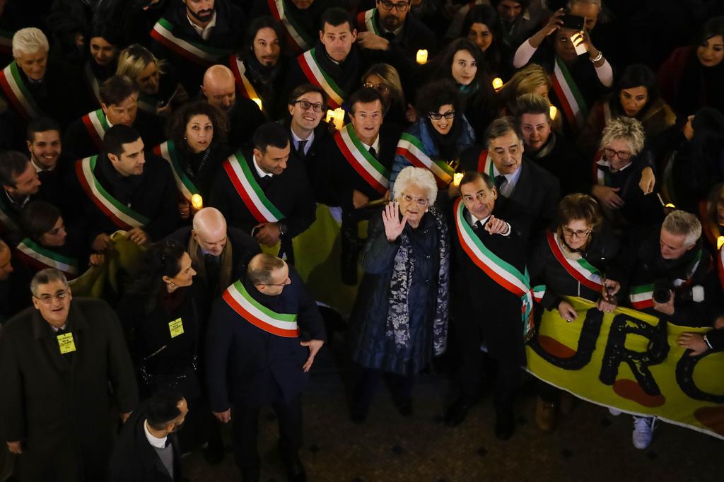 Liliana Segre (center) with Milan's Mayor Giuseppe Sala during an anti-racism demonstration in Milan's Victor Emmanuel II arcade