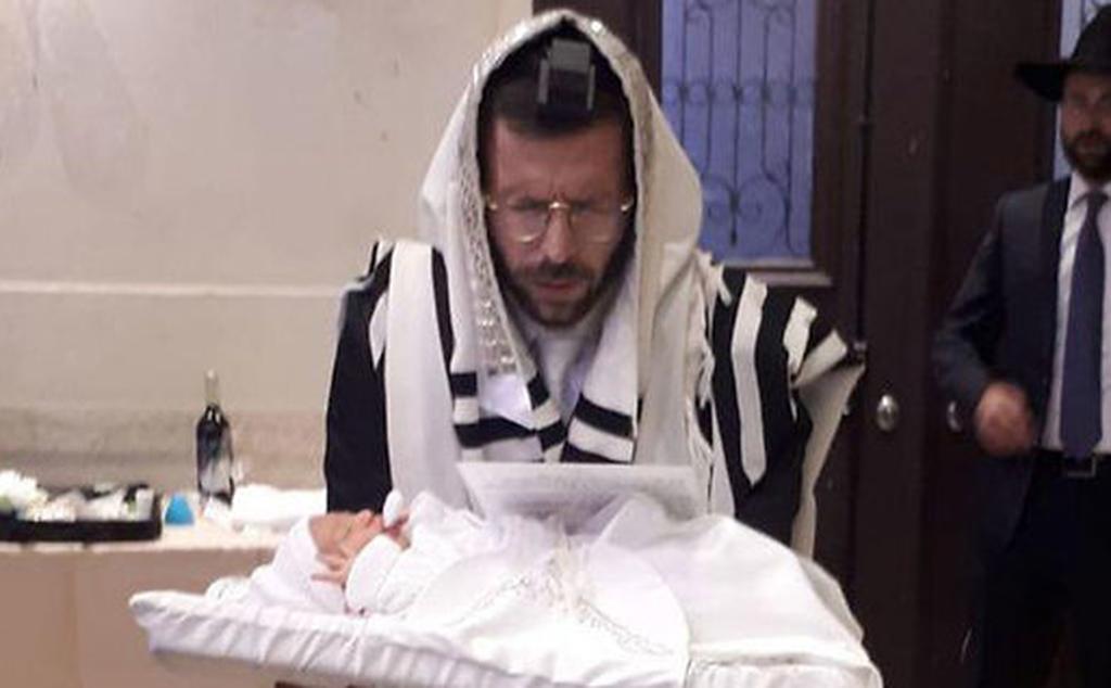 Itzik Weiss at his son Israel's bris