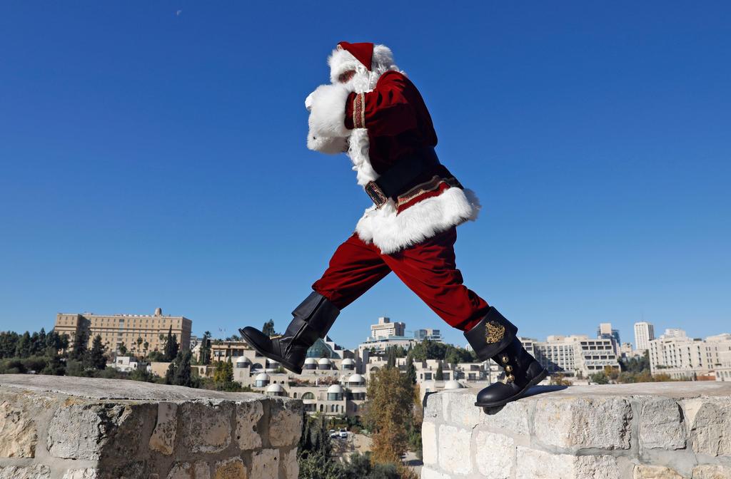 The Jerusalem Santa walks atop Jerusalem's Old City walls