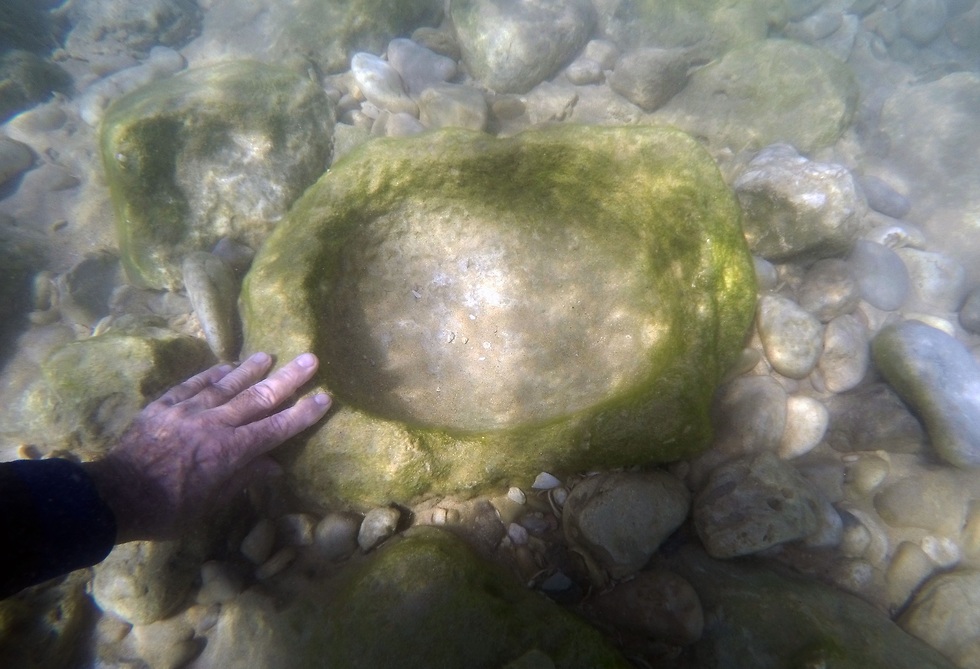 A stone bowl found at the site  