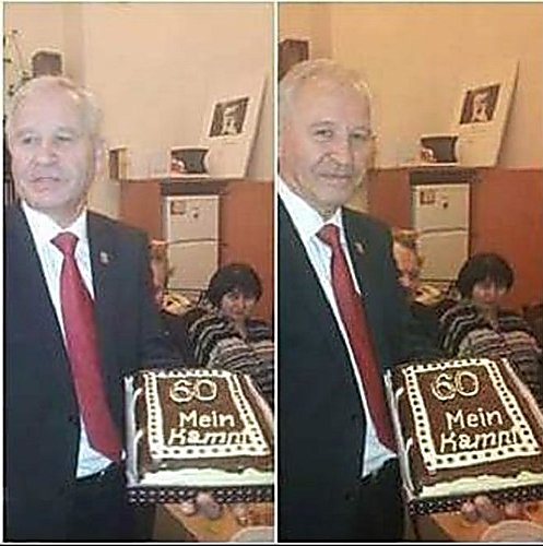 Marushchinets holding a 'Mein Kampf' cake