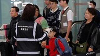 הונג קונג נמל תעופה בדיקות ל באים מ ווהאן סין נגיף מסתורי