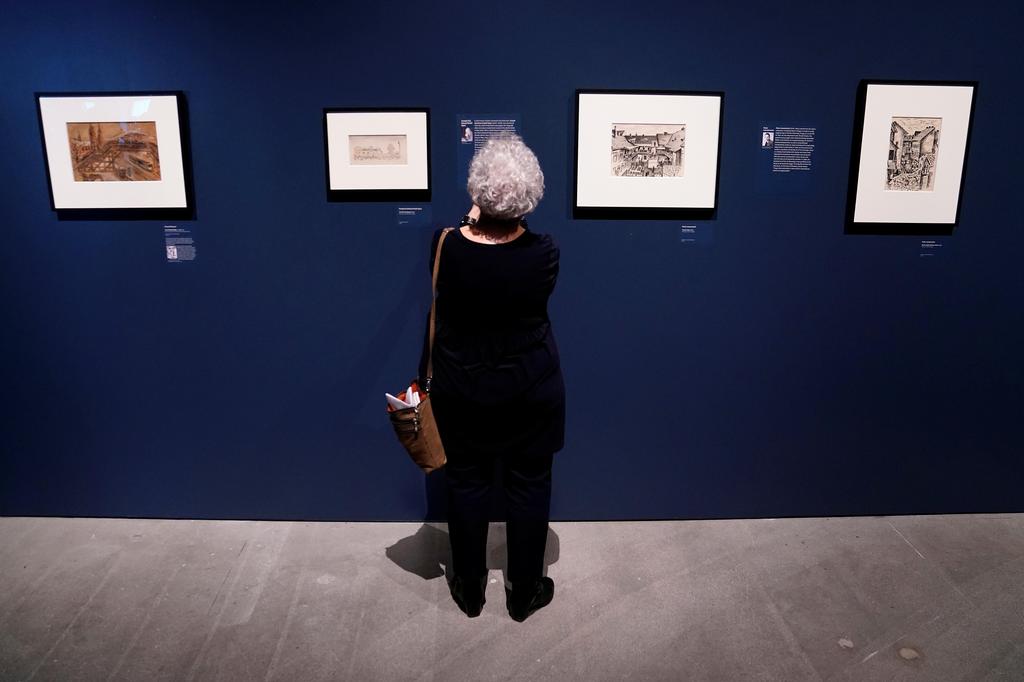 People attend the preview of "Rendering Witness" exhibition at the Museum of Jewish Heritage