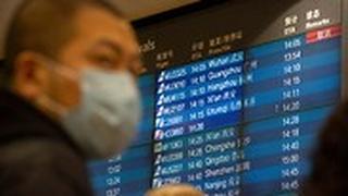 סין נמל תעופה בייג'ינג לוח טיסות בוטלו טיסות מ ווהאן נגיף קורונה