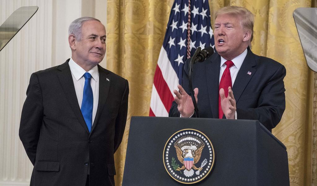 Netanyahu stands with U.S. President Donald Trump as he unveils his Mideast peace plan, Jan. 28, 2020 