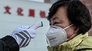 נגיף ה קורונה בייג'ינג סין מודדים חום ברחוב