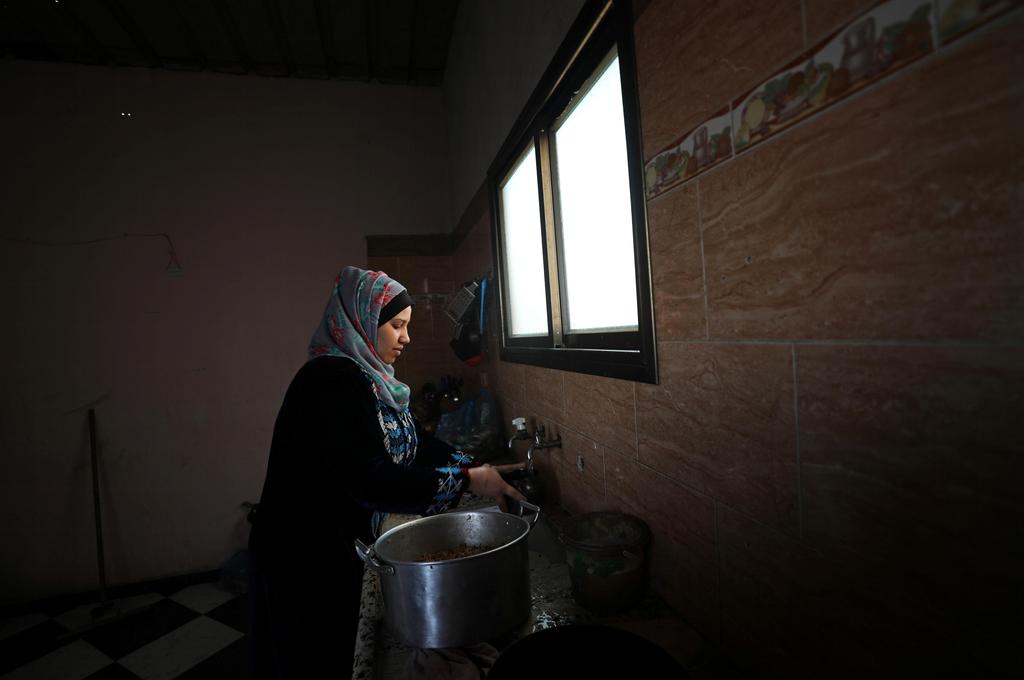 wife of Palestinian man Eyad Al-Zahar at home in Gaza