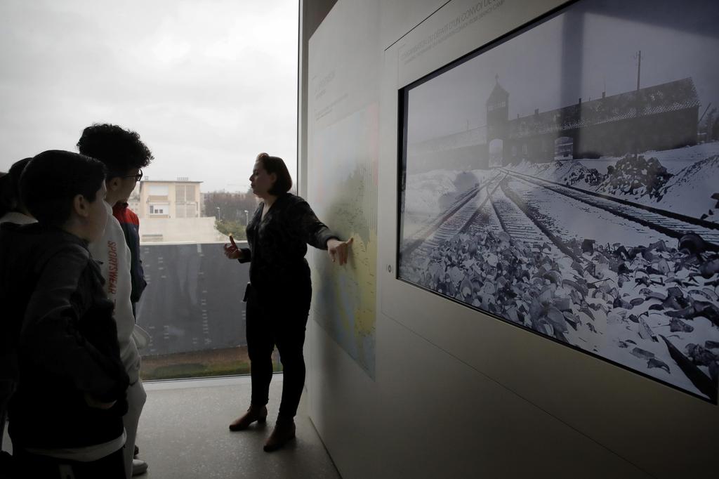 Students listen to guide Alix Quere at a workshop dedicated to Holocaust remembrance at the Drancy Shoah memorial, outside Paris, Jan. 30, 2020 