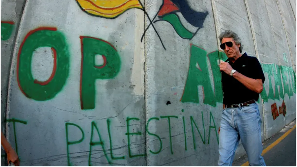 Roger Waters walks along the Israeli barrier in the Palestinian city of Bethlehem 