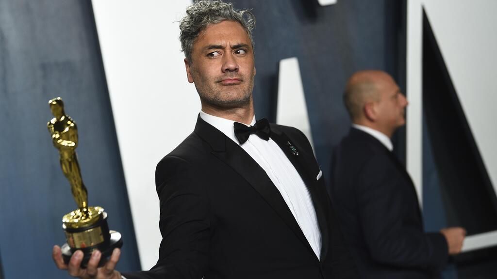 Taika Waititi, winner of the award for best adapted screenplay for 'Jojo Rabbit,' arrives at the Vanity Fair Oscar Party in Beverly Hills, Feb. 9, 2020 