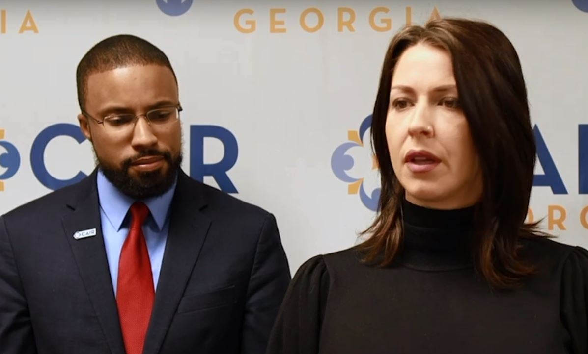 Filmmaker Abby Martin, flanked by Edward Ahmed Mitchell of the Council on American-Islamic Relations, announces her lawsuit against the State of Georgia over its Israel pledge, Feb. 10, 2020 