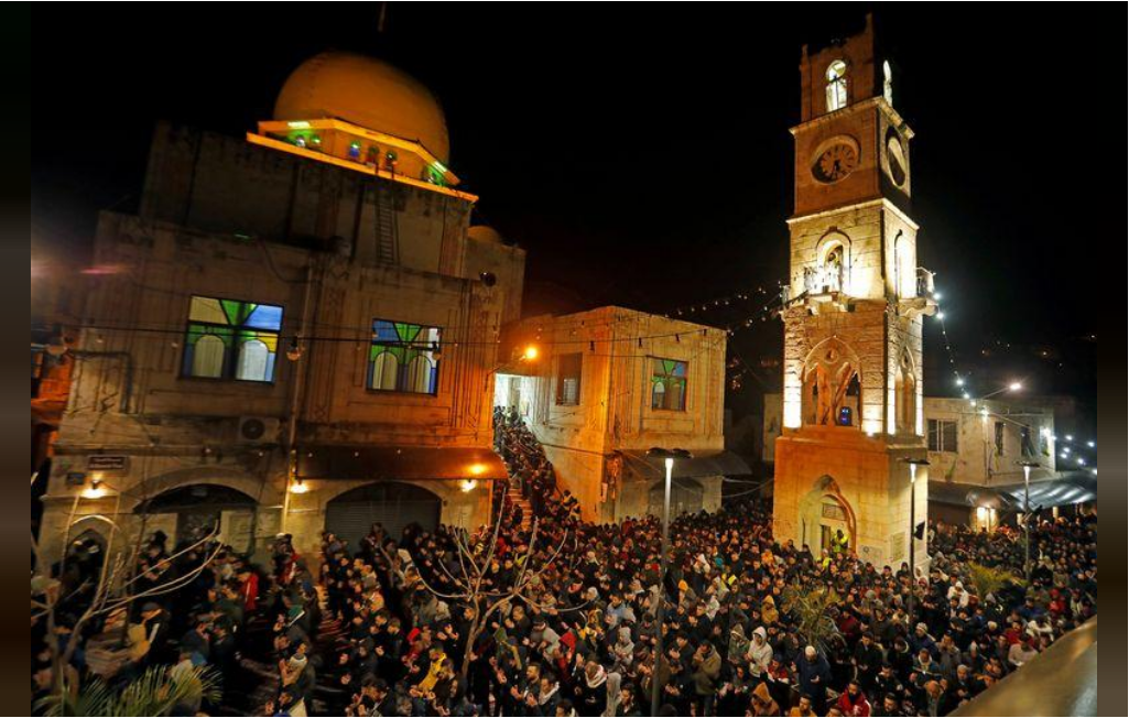 Palestinians attend the Fajr (dawn) prayer at Al-Nasir mosque in Nablus 