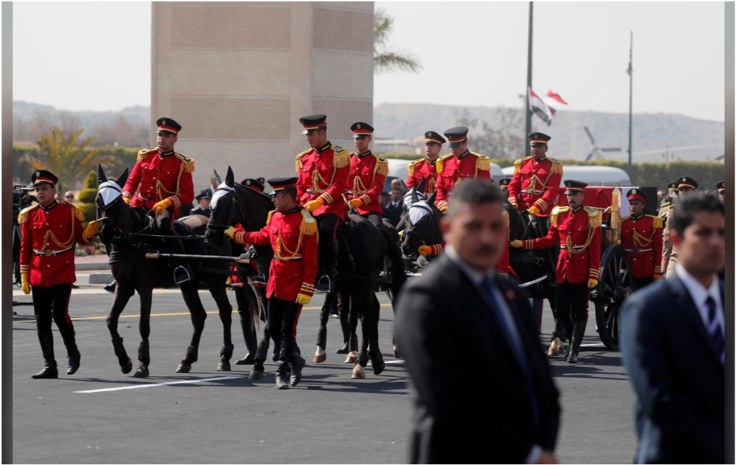 Mubarak's coffin carried in a horse drawn hearse 