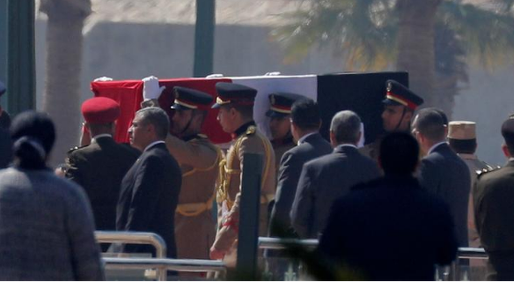 Guards carrying the coffin of Mubarak 