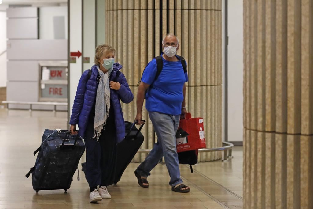 Arrivals at Ben Gurion Aiport wearing protective face masks 