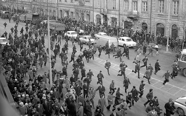A March 1968 black and white photo showing people running away as police attack near the Warsaw University during student riots. The 1968 student riots in Poland ended with an anti-Semitic campaign by the communist regime that drove an estimated 15,000 Jews from Poland 