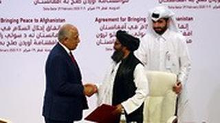 ארה"ב טליבאן הסכם שלום אפגניסטן מולה עבדול ראני ברדר מ טליבאן וזלמאי חלילזאד מ ארה"ב