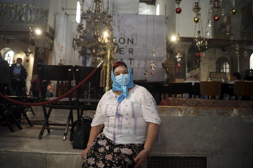 A visitor wears a mask at the Church of the Nativity in Bethlehem after a suspected coronavirus outbreak in the city, March 5, 2020 