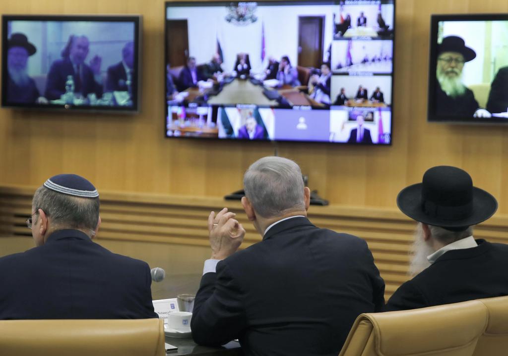 L-R: National Security Adviser Meir Ben-Shabbat, PM Benjamin Netanyahu and Health Minister Yaakov Litzman hold a coronavirus video conference from Jerusalem with European leaders, March 9, 2020 