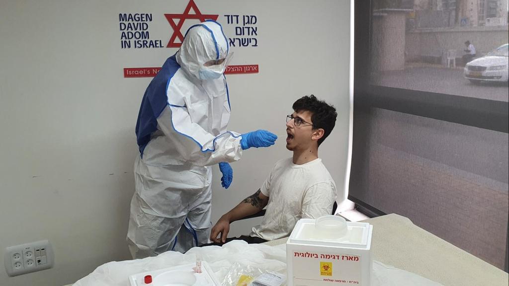 Magen David Adom medic conducting coronavirus test 