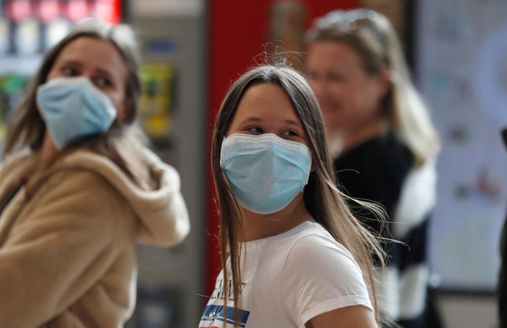 Woman wears protective mask at Ben Gurion Airport 