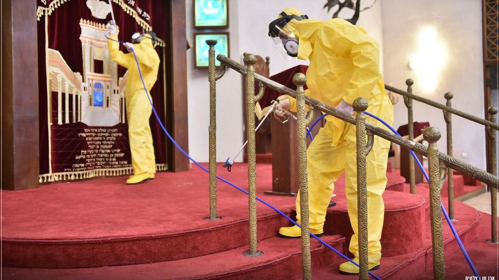  Health workers disinfecting Tel Aviv's Great Synagogue 