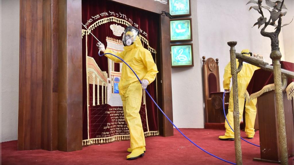  Health workers disinfecting Tel Aviv's Great Synagogue 