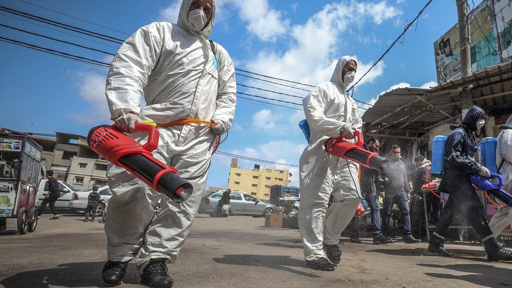  Gaza officials disinfect the streets of the Strip 