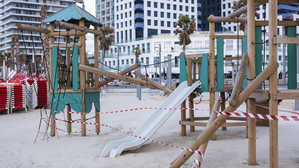 A playground on Tel Aviv beachfront is wrapped in tape to prevent   public access, March 19, 2020 