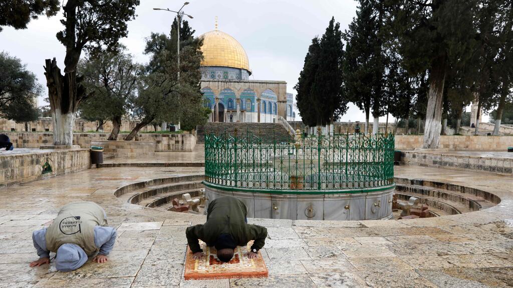 Al-Aqsa Mosque compound in the Old City of Jerusalem (Photo: AFP ) Palestinians perform their Friday prayers in the almost deserted Al-Aqsa mosque compound in the Old City of Jerusalem, after the mosques were shut in a bid to stem the spread of coronavirus, March 20, 2020