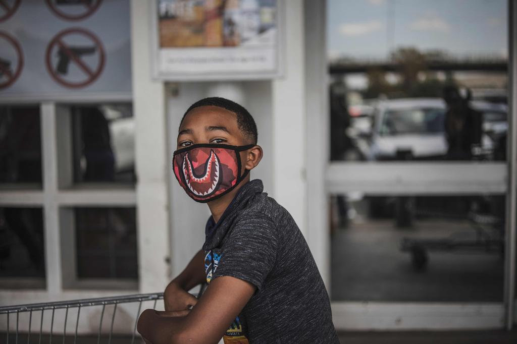 A South African boy wears a face mask against coronavirus in Johannesburg 