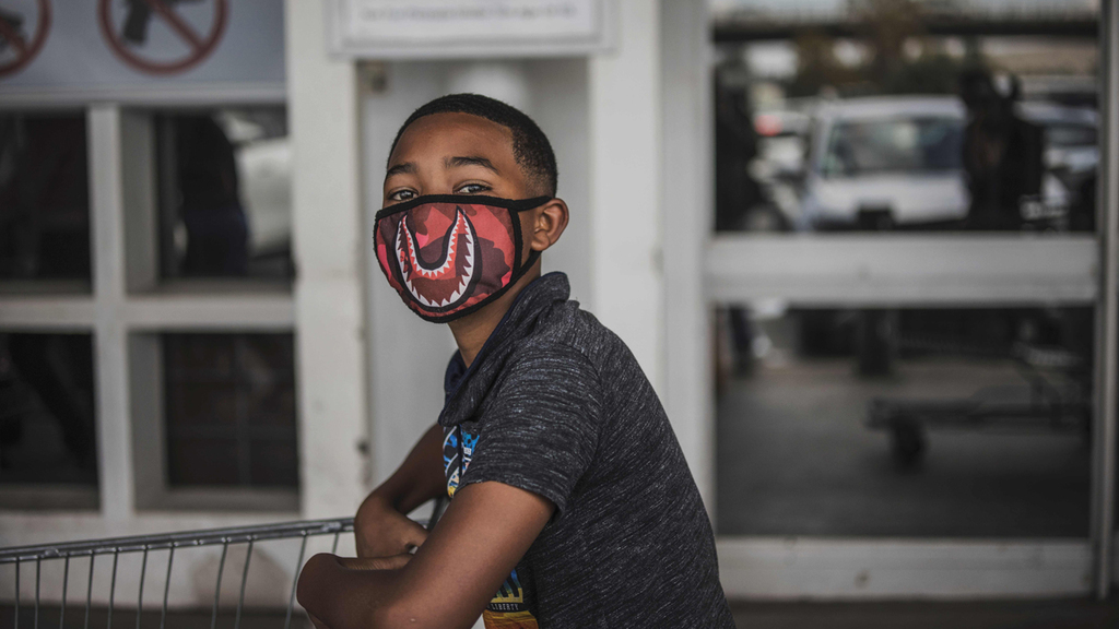 A South African boy wears a face mask against coronavirus in Johannesburg, March 2020 