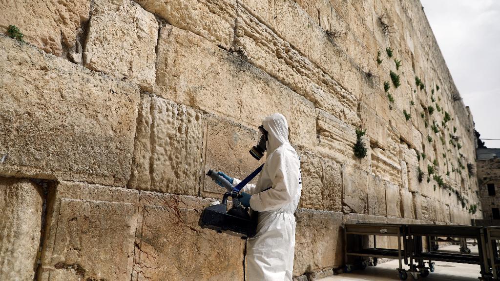A labourer sanitizes the stones of the Western Wall as part of   measures to prevent the spread of the coronavirus, March 31,   2020 