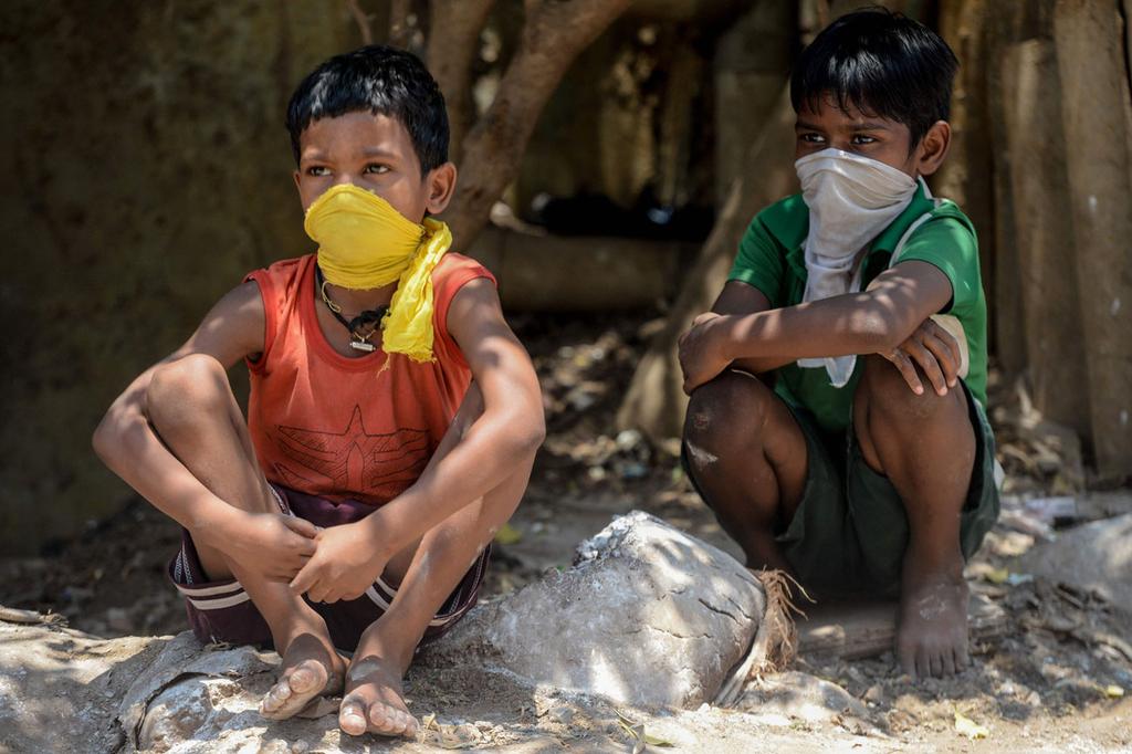 Indian children wear makeshift masks against coronavirus  