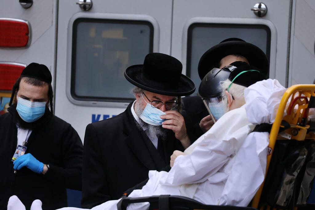 An elderly Haredi man afflicted with COVID-19 is taken to Mount Sinai Hospital in New York
