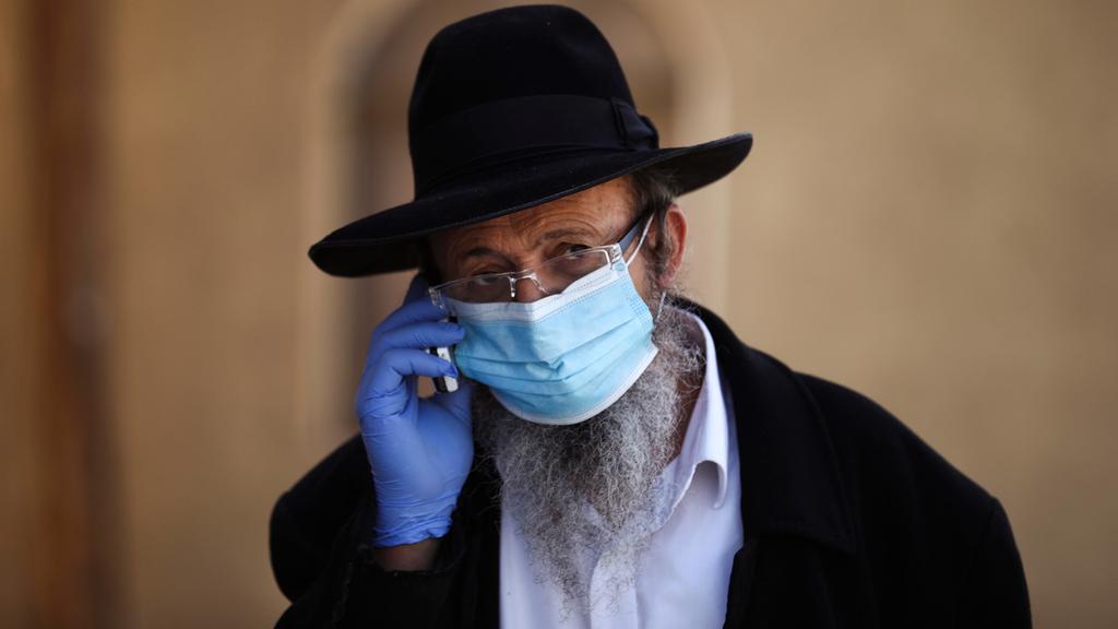  Bnei Brak resident with a beard wears a surgical mask 