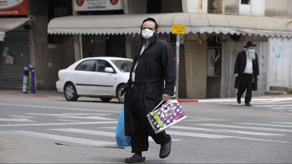  A Haredi man in Bnei Brak with a surgical mask 