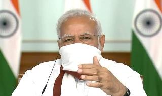 נרנדרה מודי ראש משלת הודו עם מסכה 
