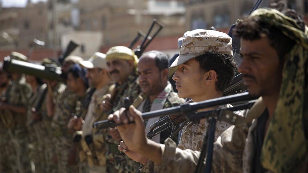  Houthi rebel fighters display their weapons during a gathering aimed at mobilizing more fighters for the Iranian-backed Houthi movement, in Sanaa, Yemen.